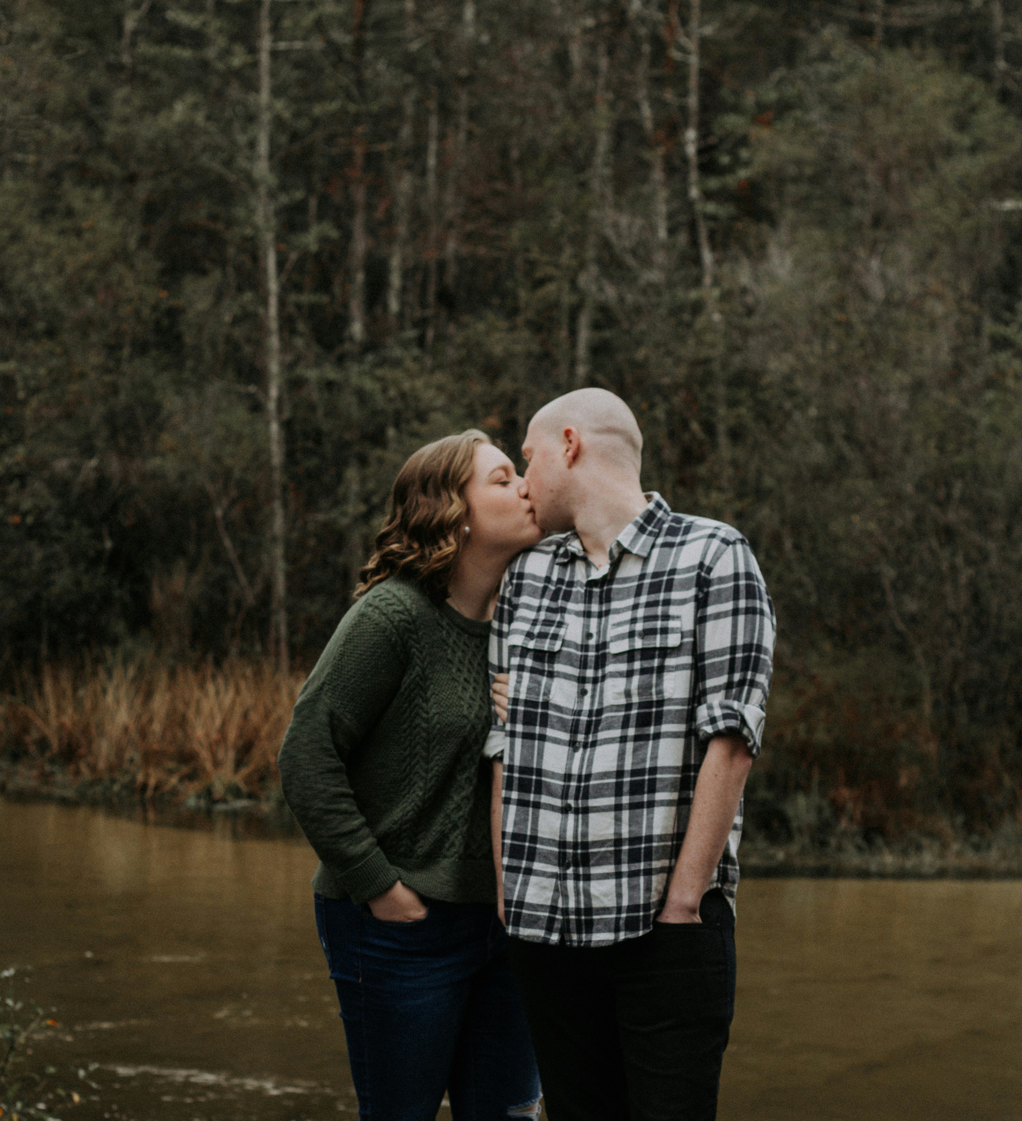 man and woman kissing each other during daytime